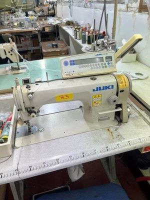 an image of a sewing machine in a factory