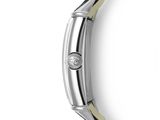 a close up of a watch with a diamond in the middle of it