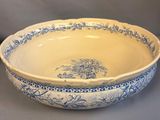 a blue and white bowl sitting on a table