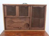an old wooden box with a bunch of plates inside of it