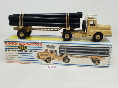 a toy truck with a large pipe attached to it ' s back