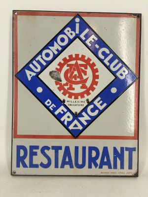 an image of a restaurant sign on a white wall with a red and blue design