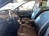 the interior of a car with a leather seat and steering wheel