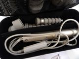a black case filled with electrical cords and a hair dryer