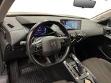 the interior of a car with a steering wheel, dashboard, and dash board