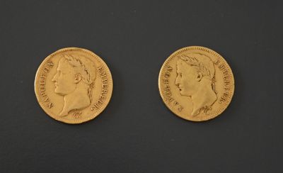 two gold sovereigns, one with the head of a man and one with a woman