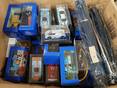 a lot of toy cars in a box on the floor