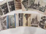 a lot of old postcards on the table