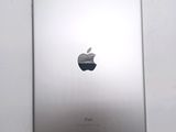 an apple ipad sitting on top of a white table next to a white wall