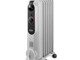 a close up of a white oil filled radiator on a white background