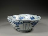 blue and white porcelain bowl with birds and flowers on it