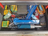 a metal box filled with assorted tools and tools