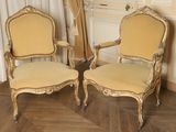 pair of antique french style chairs with gold paint and gold trim