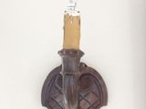 a light that is on the wall next to a wall sconce