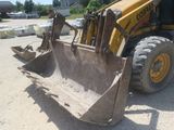 a picture of a construction vehicle that is parked in a lot
