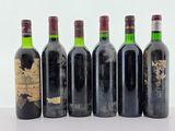 six bouteilles de vin sont alignées dans une rangée