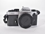 a black and white photo of a camera on a white surface