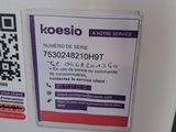a white refrigerator with a qr code attached to it