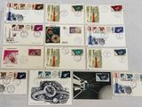 a lot of stamps that are on the table