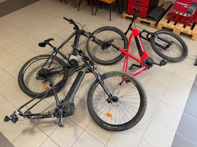 three bikes that are sitting on the floor in the store