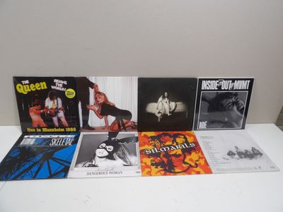 various cd ' s on a white table with a white background