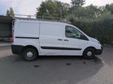 a white van that is parked in a parking lot