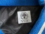 the back of a blue sweater with a white and black stripe on it