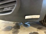 a close up of a car ' s bumper with a sticker on it
