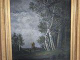 an oil painting of a landscape with trees in a gold frame on a wooden easel