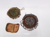 three different types of purses are displayed on a white surface