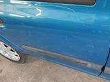 a blue car that is parked in a garage