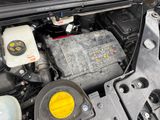 the engine compartment of a car with the hood open