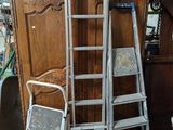 a ladder leaning up against a cabinet in a room