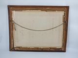 an old picture frame with a rope hanging from it ' s side