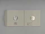 a book with a picture of a silver coin and a picture of a silver coin
