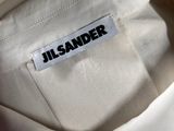a close up of a white shirt with a name tag on it