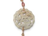 an image of a white jade pendant with a bird on it