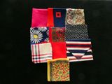 many different types of handkerchiefs laid out on a black surface