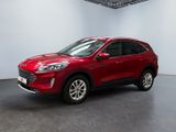 Une Ford Escape rouge de 2020 est garée dans une pièce blanche