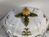 a white plate with a yellow flower on it