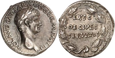 a silver coin with an image of a woman on it