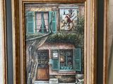 une photo d'un tableau représentant une maison accrochée au mur