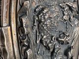 a silver ring with a picture of a lion on it
