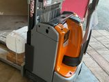 a fork lifter that is parked in a garage