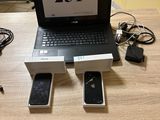 a laptop computer sitting on top of a wooden table
