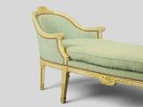 an image of a chaise lounger with a green upholstered seat