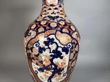 a vase with a blue and orange design on it