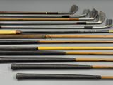 a group of golf clubs are lined up on a table