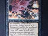 a close up of a card with a picture of a demon on it