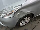 a silver car that is parked in a parking lot